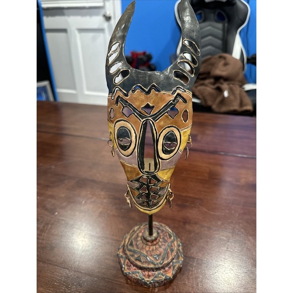 decorative mask sculpture, possibly inspired by tribal or‎ African art. Design - Picture 1 of 7